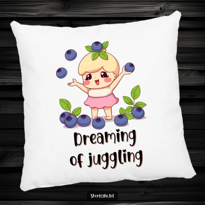 Funny pillow featuring a shortcake character playfully juggling blueberries, offering comfort and whimsical charm.