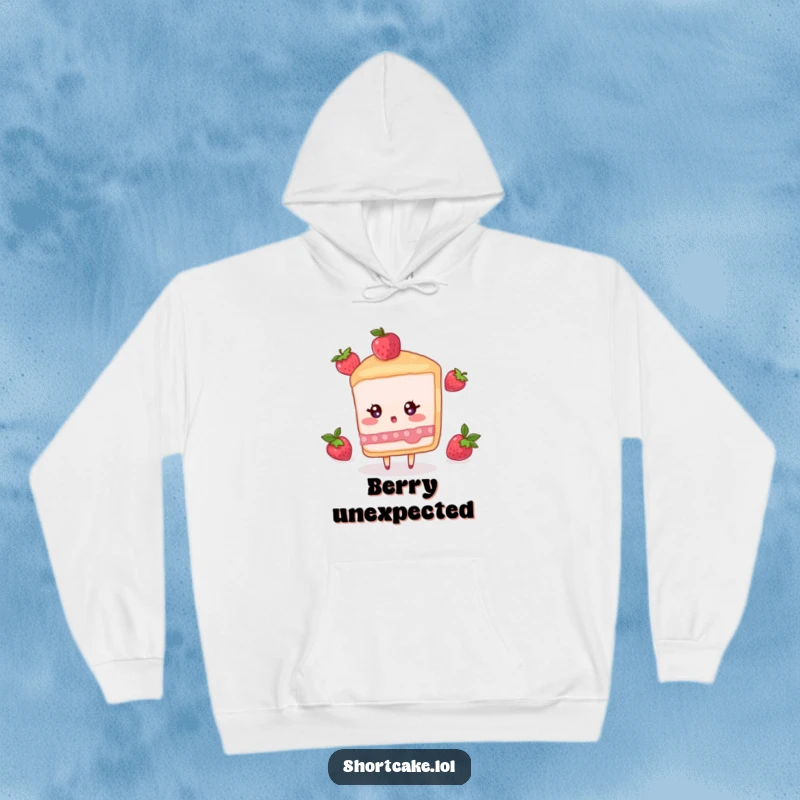 Funny hoodie featuring a shortcake slice character with wide eyes, reacting in surprise to a falling berry.