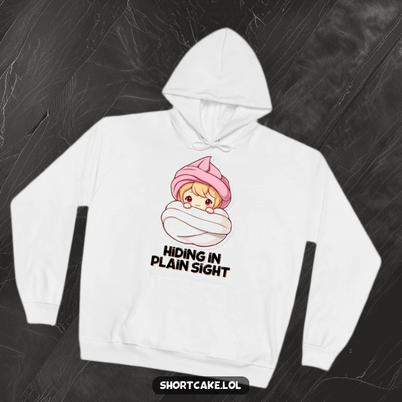 Funny cozy hoodie with a shortcake character peeking from a meringue swirl, offering warmth and a playful, humorous vibe.
