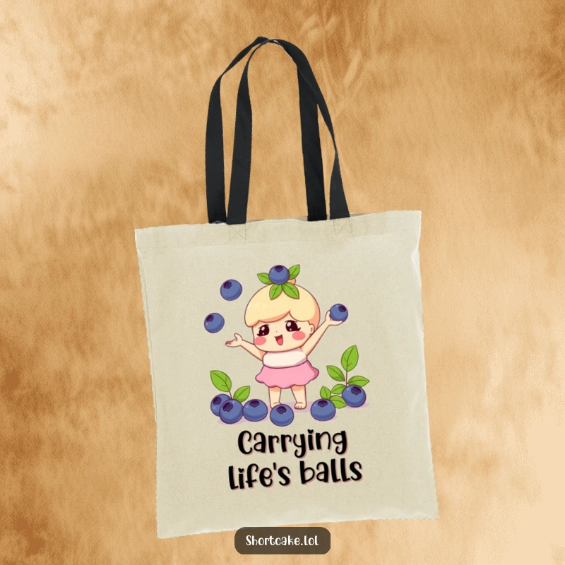 Funny tote bag with a shortcake character playfully juggling blueberries, perfect for carrying essentials with playful skill.